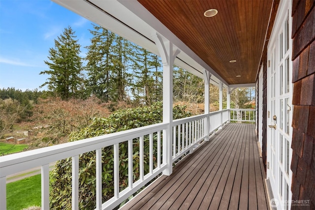 wooden terrace featuring covered porch