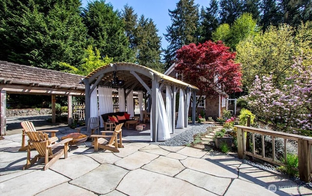 view of patio / terrace featuring an outdoor fire pit and a pergola