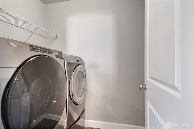 washroom with laundry area and separate washer and dryer