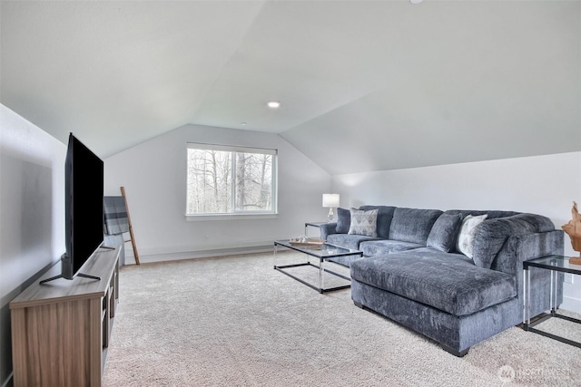 living area with vaulted ceiling, carpet floors, and baseboards