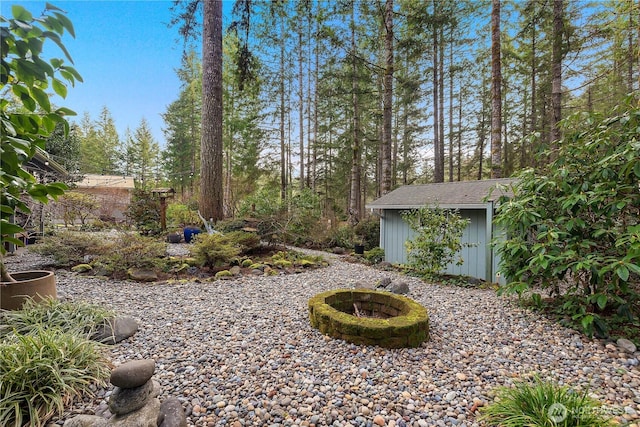 view of yard featuring an outbuilding and a shed