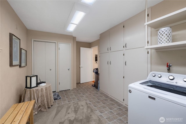 laundry area featuring cabinet space and washer / clothes dryer