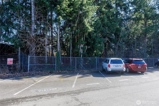 uncovered parking lot with fence