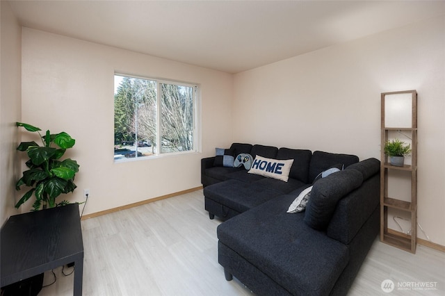 living room featuring baseboards and wood finished floors