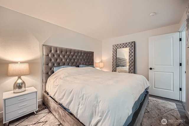 bedroom featuring wood finished floors