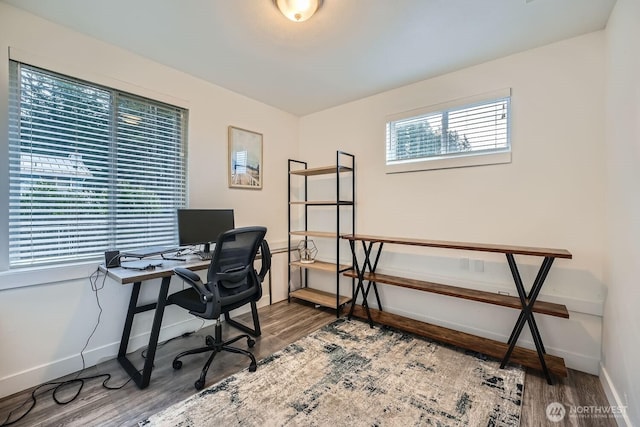 office featuring baseboards and wood finished floors