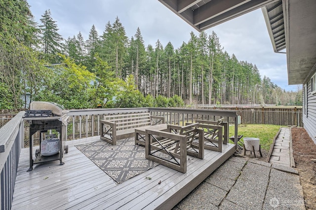deck featuring a grill and fence