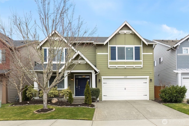 view of front of property with a garage, driveway, a front lawn, and board and batten siding