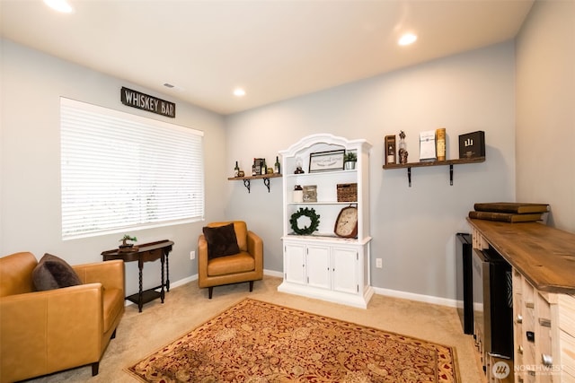 sitting room featuring recessed lighting, light colored carpet, visible vents, and baseboards