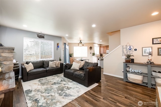 living room featuring a ceiling fan, baseboards, dark wood-type flooring, and recessed lighting