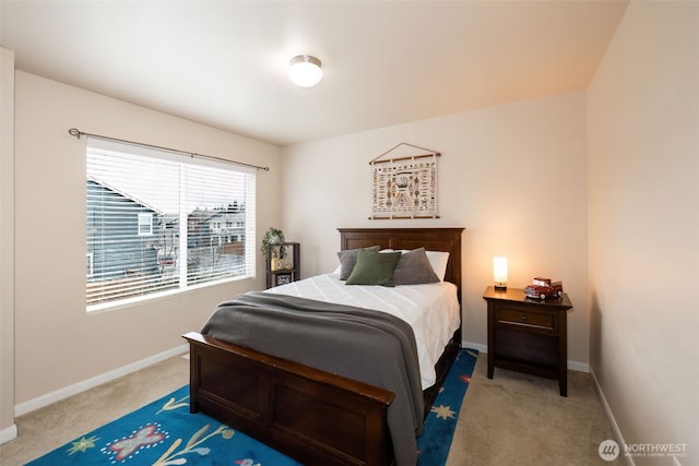 bedroom with baseboards and carpet flooring