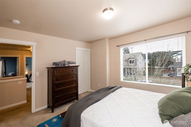 bedroom with visible vents, baseboards, and carpet flooring