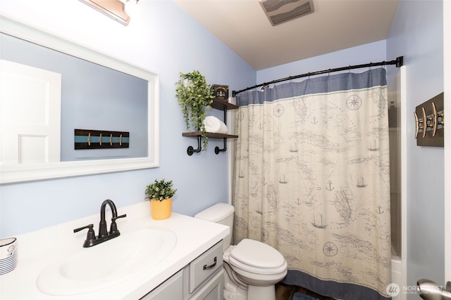 bathroom with toilet, visible vents, shower / bath combination with curtain, and vanity