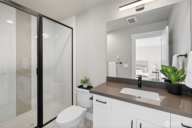 full bath featuring toilet, a stall shower, vanity, and visible vents