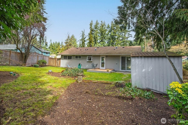 rear view of property with a patio area, fence, and a lawn