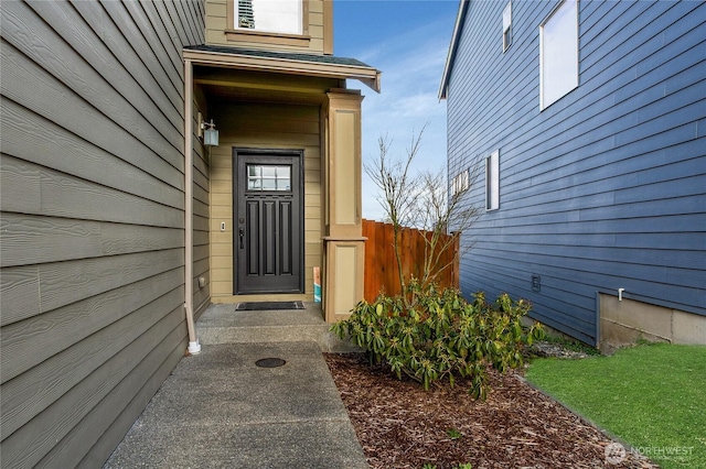 property entrance featuring fence