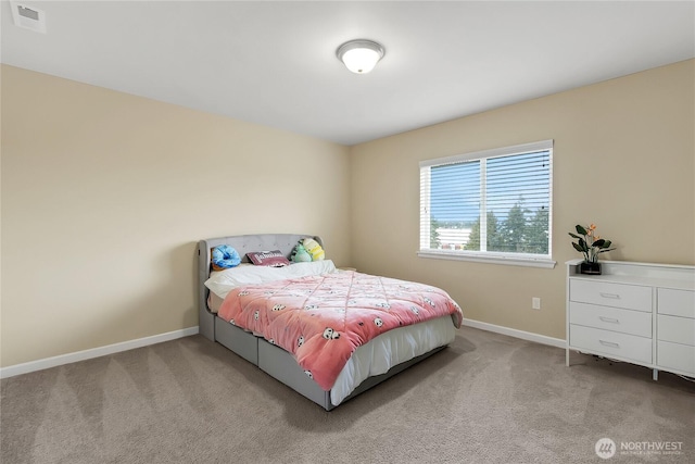 carpeted bedroom with visible vents and baseboards