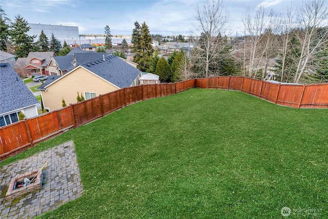 view of yard with a residential view and a fenced backyard