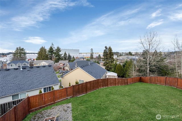 view of yard with a residential view and a fenced backyard