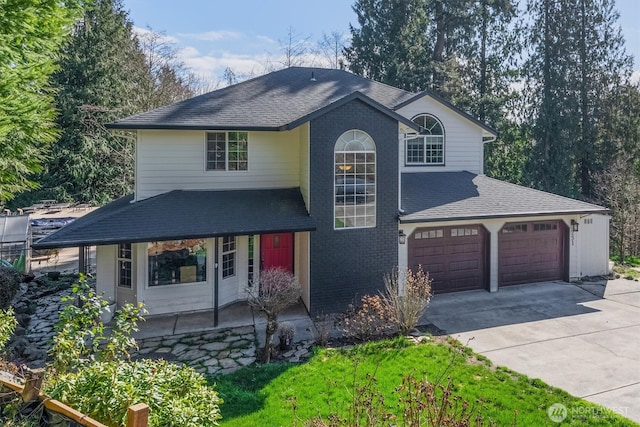 view of front of property with brick siding, concrete driveway, and a shingled roof