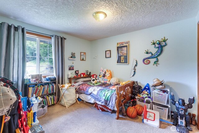 carpeted bedroom with a textured ceiling