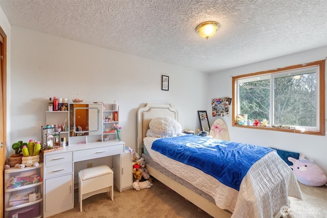 bedroom featuring light carpet and a textured ceiling