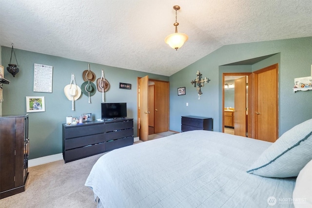 carpeted bedroom featuring baseboards, lofted ceiling, and a textured ceiling