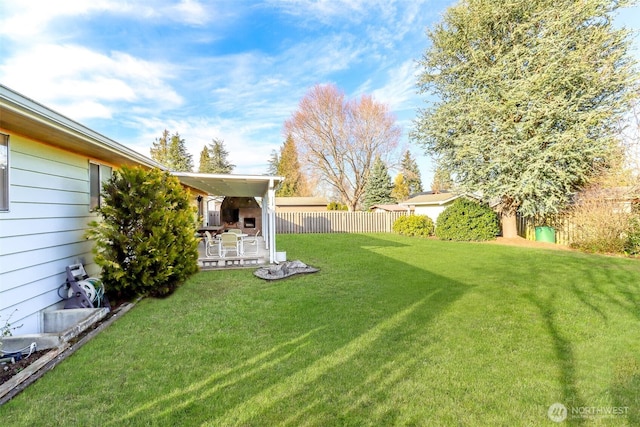 view of yard featuring fence and a patio