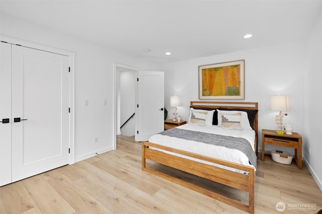 bedroom with baseboards, light wood-style flooring, and recessed lighting