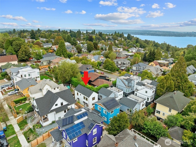 bird's eye view featuring a water view and a residential view