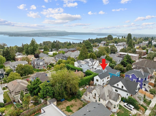 aerial view with a residential view and a water view