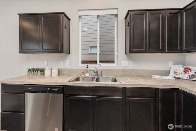 kitchen with stainless steel dishwasher, light countertops, dark brown cabinetry, and a sink