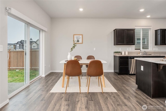 dining area featuring dark wood-style floors, recessed lighting, and baseboards