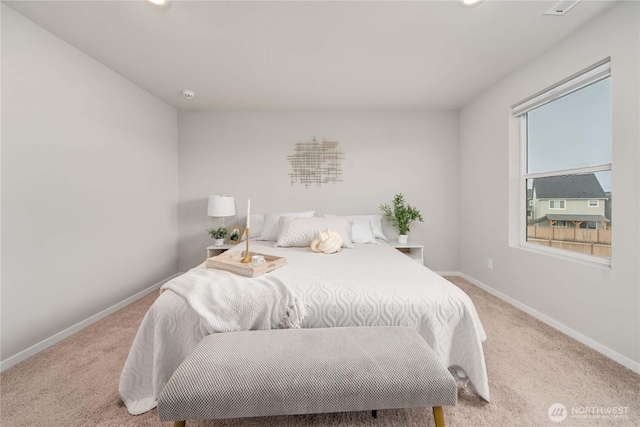 bedroom featuring carpet flooring and baseboards