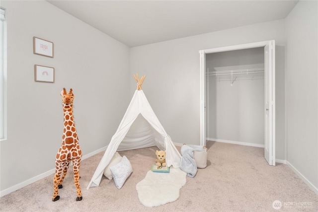 playroom with carpet flooring and baseboards