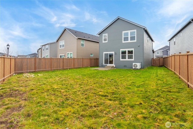 rear view of property featuring ac unit, a lawn, a fenced backyard, and entry steps