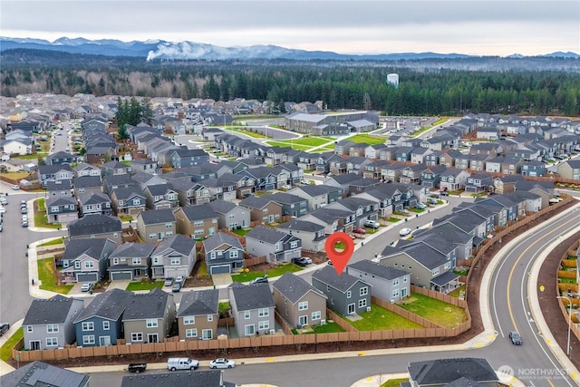 aerial view featuring a mountain view and a residential view