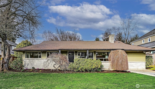 single story home with stone siding, a chimney, a front yard, and a shingled roof