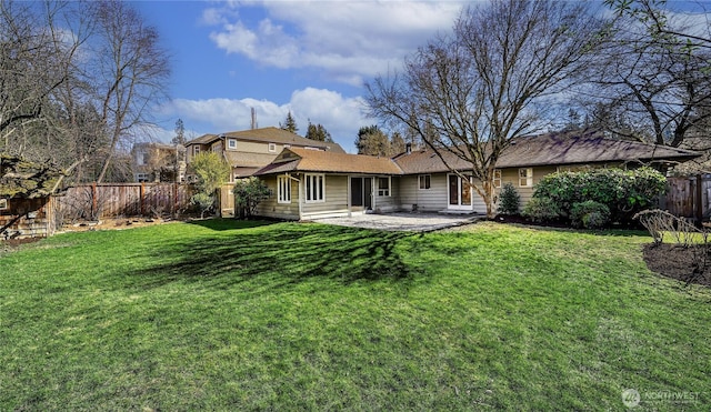 back of house with a yard, a patio, and fence