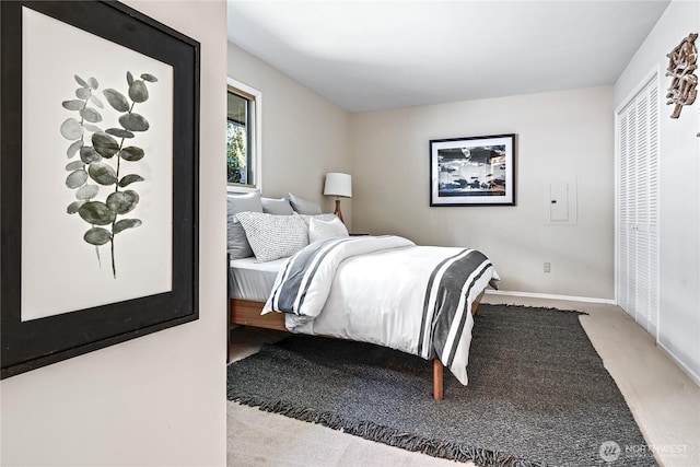 bedroom featuring carpet flooring and baseboards