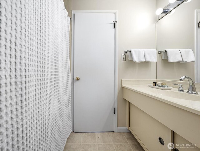 bathroom featuring tile patterned flooring, vanity, and a shower with curtain