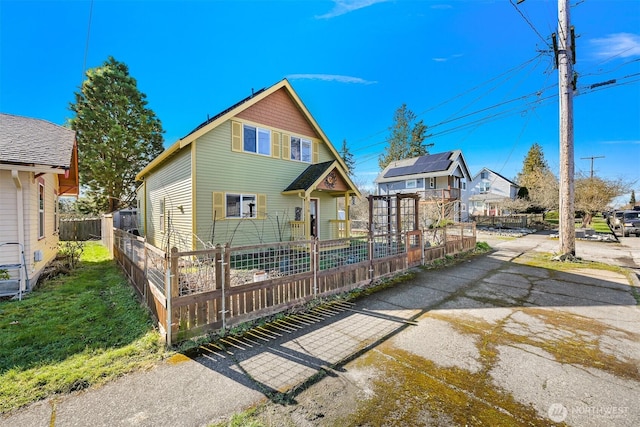 view of front of property featuring fence private yard