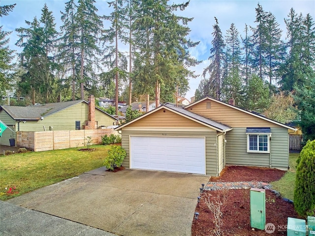 view of front facade featuring a garage, fence, a front lawn, and concrete driveway