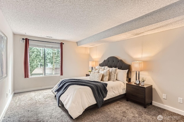 carpeted bedroom with visible vents, baseboards, and a textured ceiling