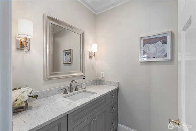 bathroom featuring ornamental molding and vanity