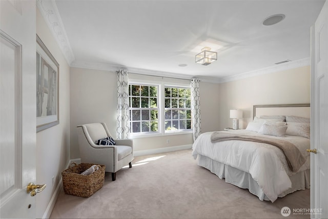 bedroom with carpet floors, visible vents, ornamental molding, and baseboards