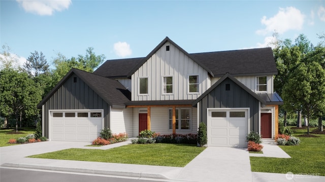 modern farmhouse style home featuring concrete driveway, a front lawn, board and batten siding, and an attached garage