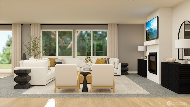 interior space featuring plenty of natural light, a fireplace, and wood finished floors