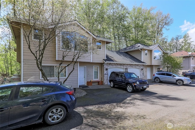 view of front of house with a garage and aphalt driveway