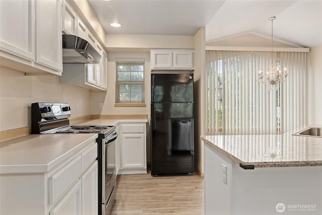 kitchen with stainless steel electric stove, light wood-style flooring, freestanding refrigerator, exhaust hood, and white cabinets